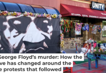 Flowers, painted benches and handmade memorials surround a mural of George Floyd at George Floyd Square on May 18, 2025. Kerem Yucel/AFP via Getty Images